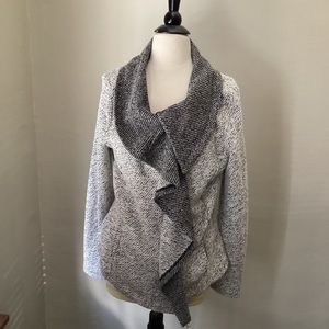 Sweater with off-center zipper.  Very flattering